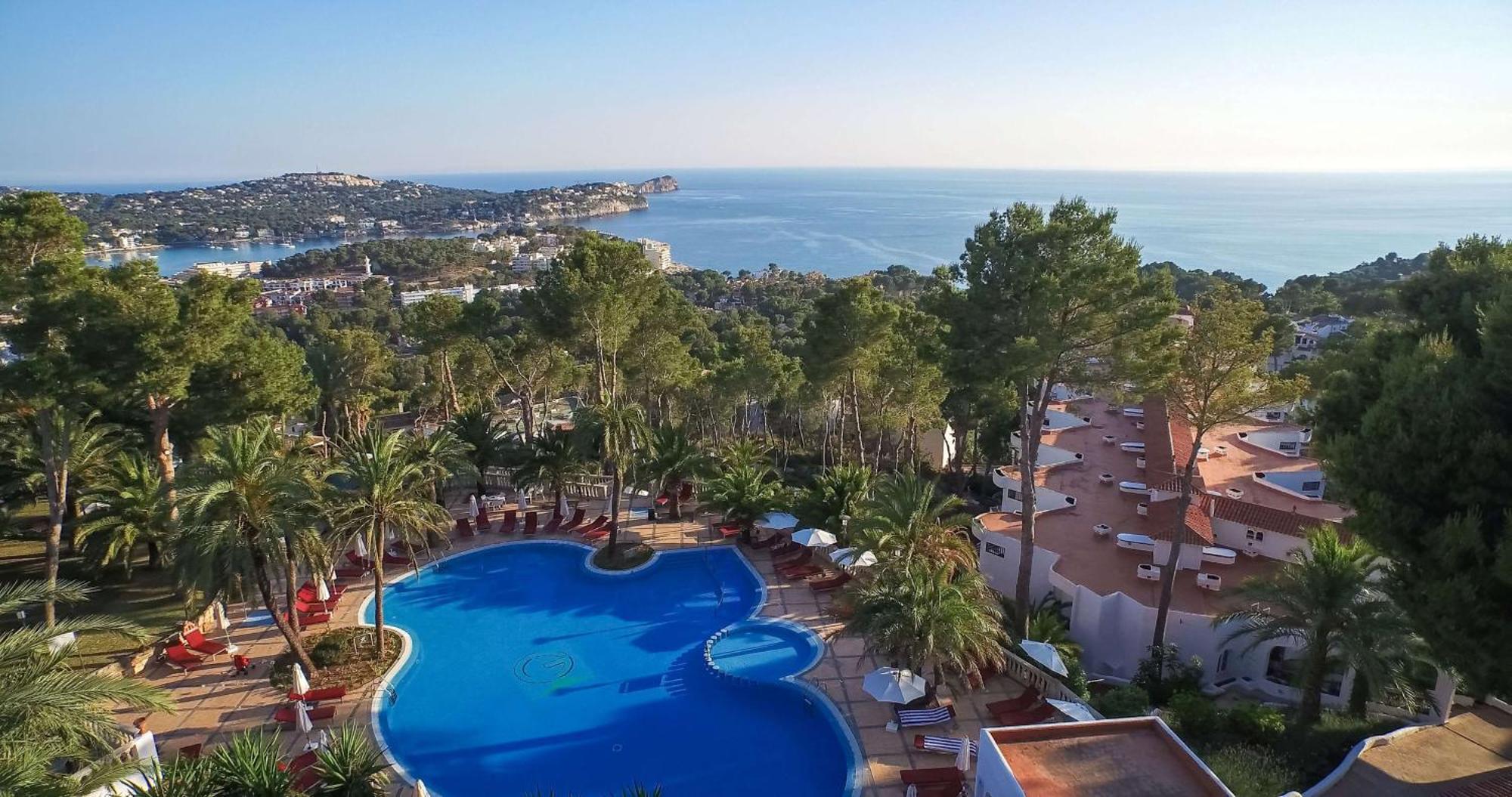 Hilton Mallorca Galatzo Peguera Exterior photo A swimming pool at a hotel in Mallorca, Spain