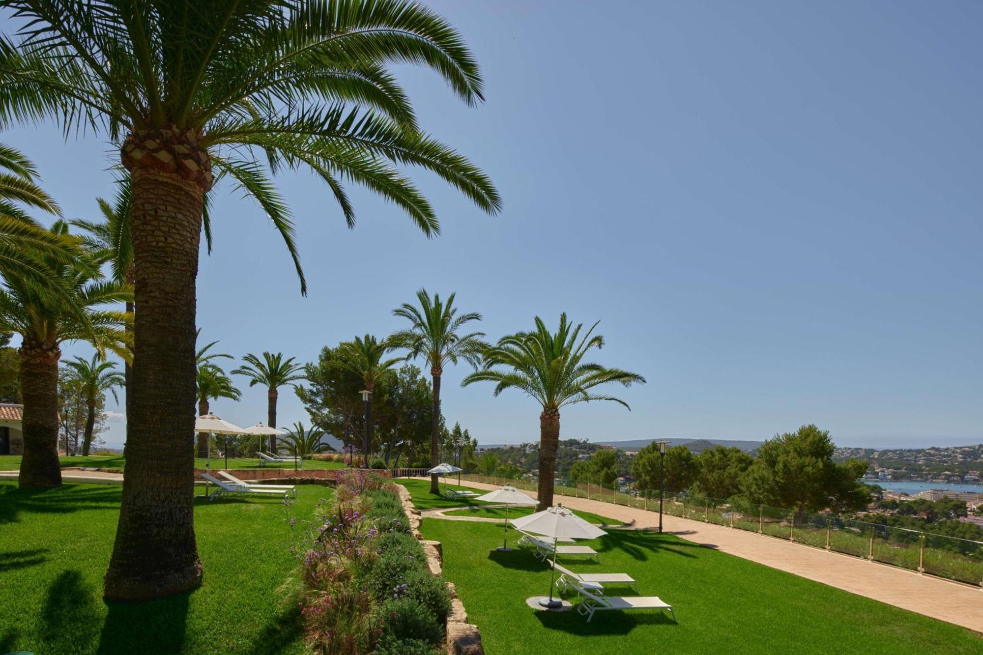 Hilton Mallorca Galatzo Peguera Exterior photo The gardens of the hotel